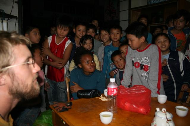 China, Meihua town, Guangdong prov. - A warm welcome by students on their way home.  