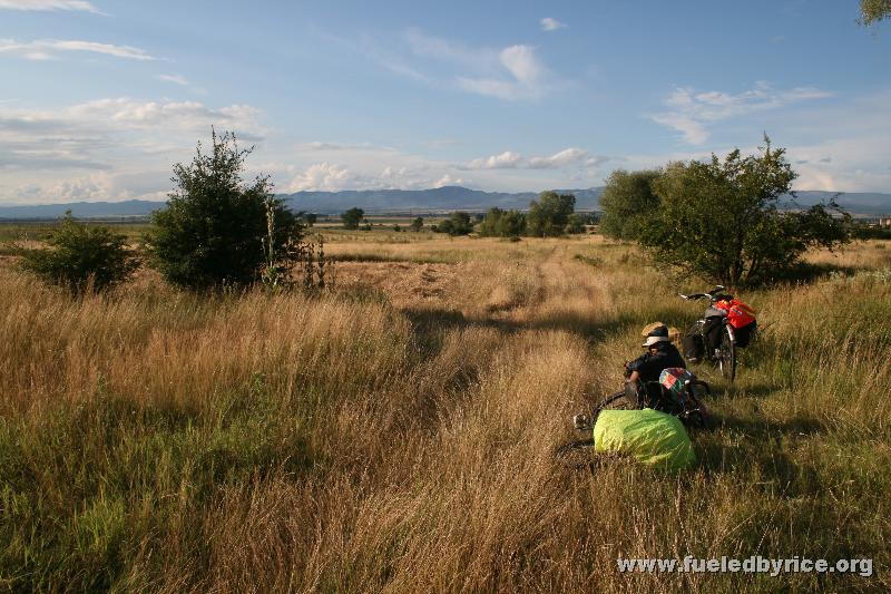 Bulgaria 20km east of Sofia - Nakia in the grass at the end of a long day; preparing to camp