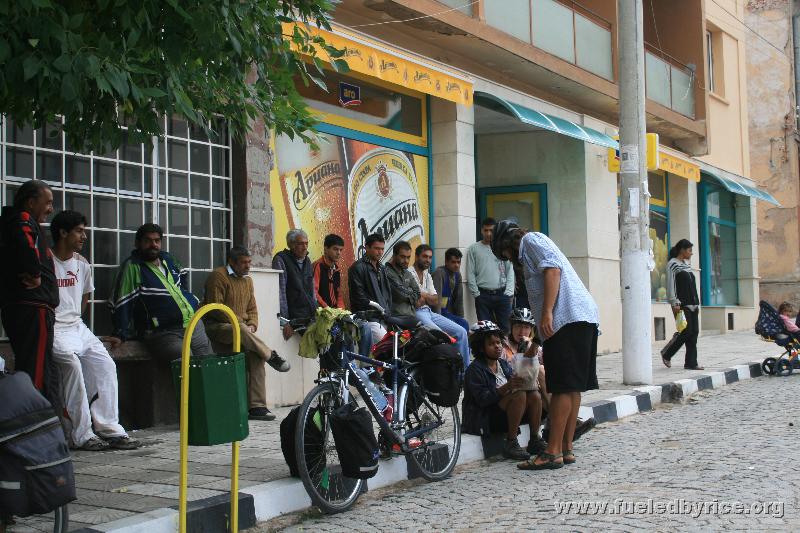 Serbia - border town, loitering men watch us