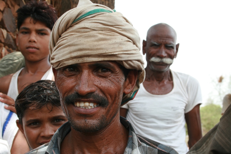 India, Rajistani village - (Drew) We stopped to ask for the nearest market in the midday heat, and they warmly welcomed us to st