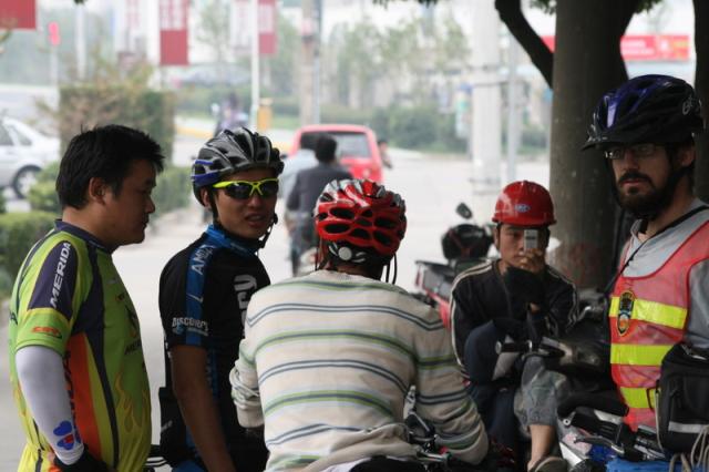 Oct 22 2007 - Cai qun, 2nd from left, a young high-end bike shop owner and expert mountain biker, with his friend, far left, who