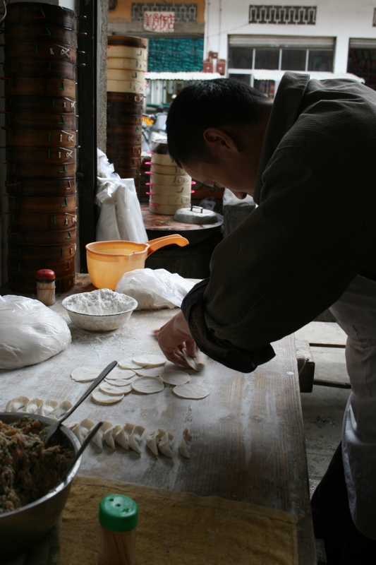 Making jiaozi (Chinese dumplings, or potstickers)