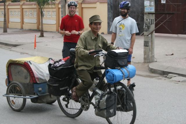 Vietnam, Ning Bihm town - a local trying to ride the Moose (Jim's bike)