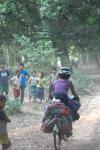 Lao - Nakia biking through a small village on a back road