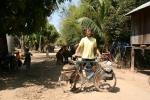 Cambodia - The Mekong River dirt road shortcut to Phenom Penh and the never ending village.