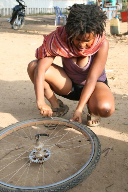 Cambodia - Nakia fixing another flat...though it has been awhile now.