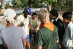Cambodia - Jim helping to fix Nakia's flat attracts locals