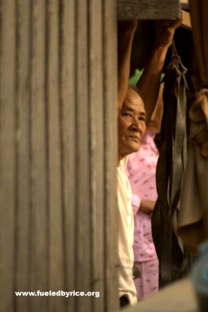 Cambodia - A man looks on in a small market town 40km north of Phnom Pehn.