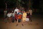 India, Katna village, West Bengal  - On stage after our concert for Kata village with Brian Heilman (SJU'05 back R in white), Sh