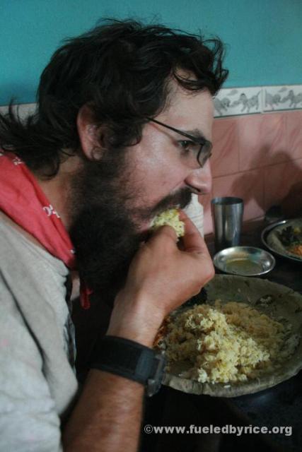 India, West Bengal - Jim eating lunch. In India, most people eat with their hands. With rice and dal, it certainly is a bit wet 