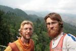 India, Darjeeling - Andrew & Peter cycling down through the Makaibari Tea Estate