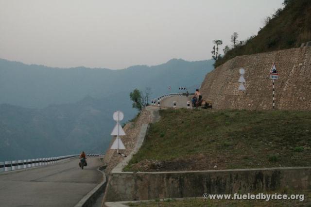 Nepal, Himalayan foothills, road to Sindhuligati - Drew & Jim tackeling the never ending Japanese-built switch back road [Pe