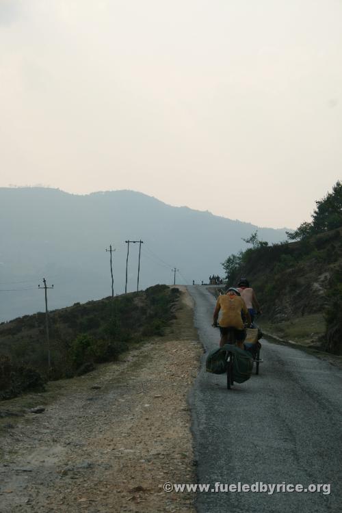 Nepal, Himalayan foothills, Sindhuli area - Drew and Jim climbing another long up on our backroad to Kathmandu