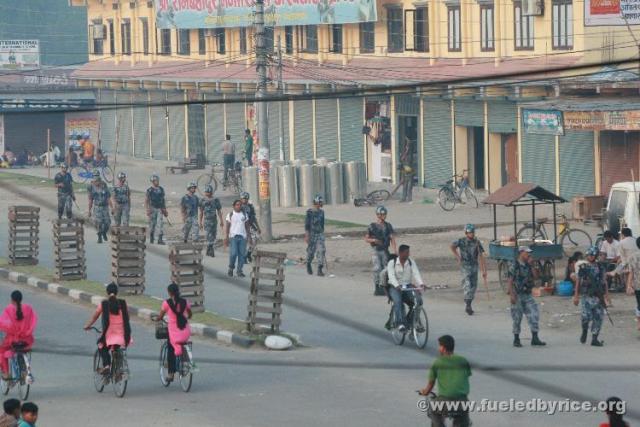 Nepal, Mahendranagar (Nepal-India border) - A common sight in Nepal, police soldiers on patrol. Biking along the highways, we sa