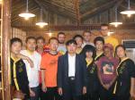 China, Jiangsu province, Shuyang town, Oct 4 2007 - Mr. Wang (center suit) and the young owner (in orange left of Mr. Want) gave
