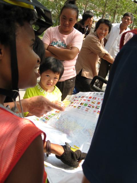 China - Nakia giving a geography lesson at one of our roadside stops. 