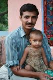India, Rajistani village - (Drew)- Our host with child at his home where we stayed for one night when his fellow villagers found